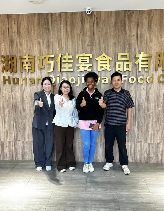 Seminar participants visiting a food company in Hunan, China