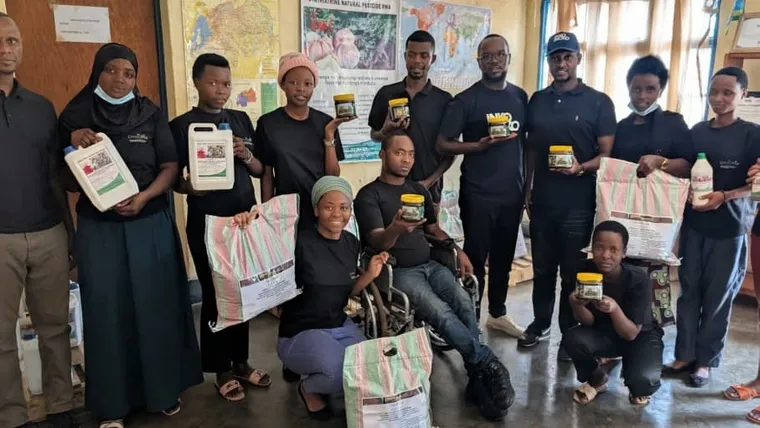 Our team and community members holding HINGA WEZE and Nectartrin Honey