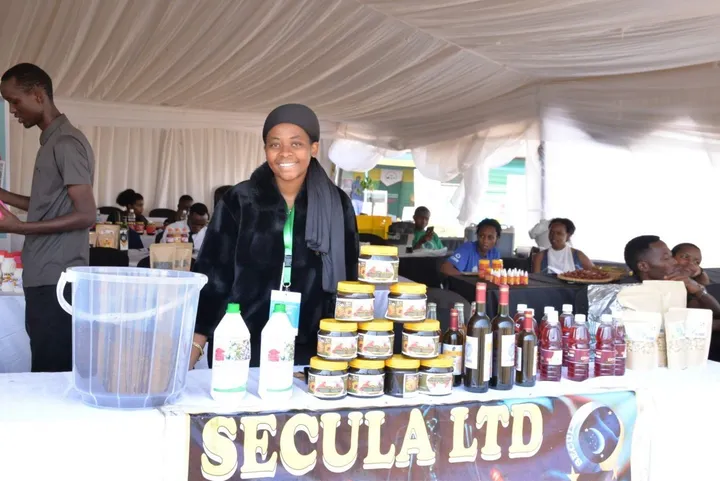 Cynthia at an exhibition stand with Nectartrin Honey and HINGA WEZE