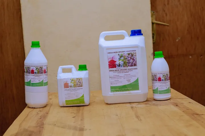 HINGA WEZE organic pesticide in four container sizes on a table