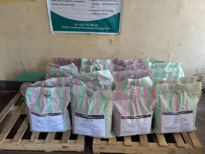 Bags of CYNTHIATRIN organic growing medium stacked on pallets